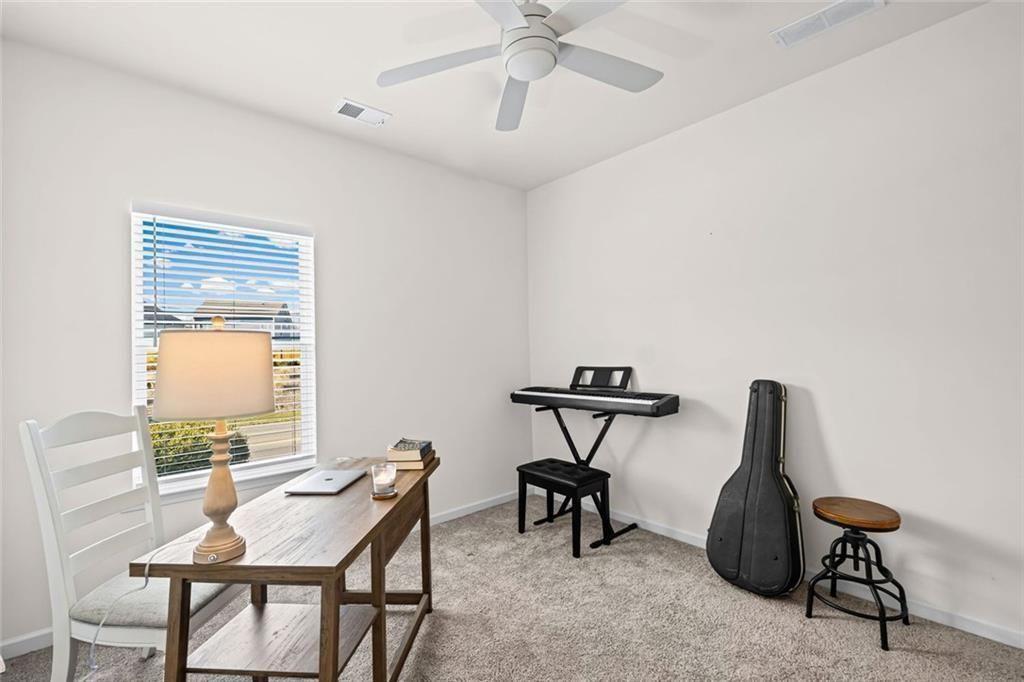 252 Renford Road Ball Ground, GA 30107 - Photo 22 of 36 a view of a workspace with furniture and a window