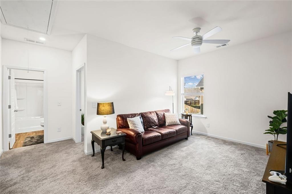 252 Renford Road Ball Ground, GA 30107 - Photo 24 of 36 a living room with furniture and a window