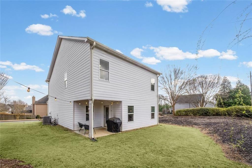 252 Renford Road Ball Ground, GA 30107 - Photo 29 of 36 a view of a house with a yard