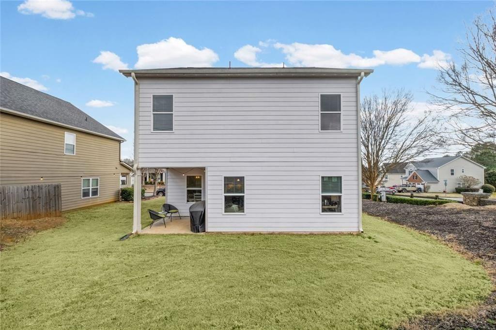 252 Renford Road Ball Ground, GA 30107 - Photo 31 of 36 a view of a house with a yard