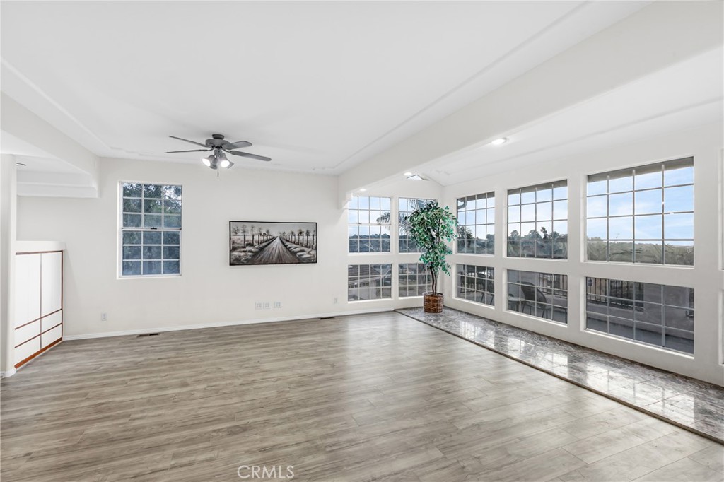 508 Mesa View Drive Arroyo Grande, CA 93420 - Photo 14 of 55 a view of an empty room with wooden floor and windows
