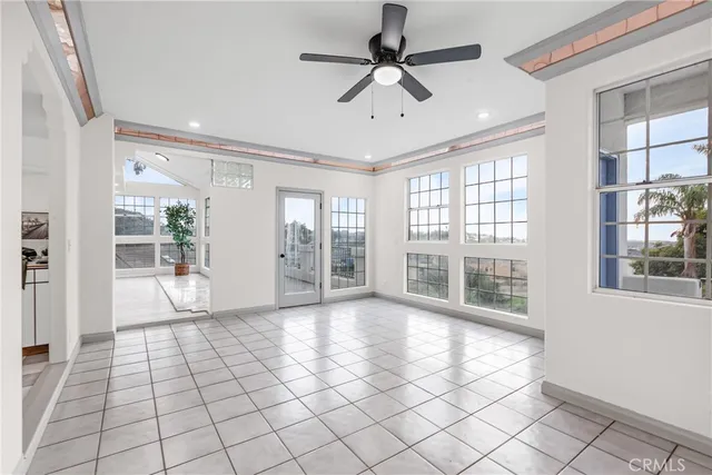 a kitchen with white cabinets appliances and a sink
