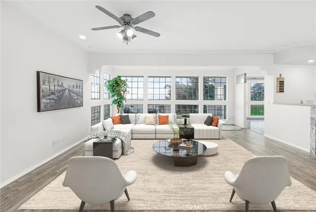 a kitchen with kitchen island a stove a sink and a refrigerator with wooden floor