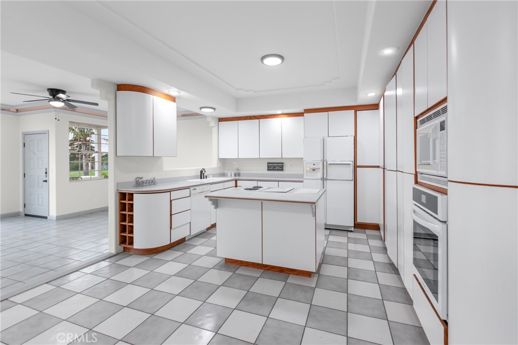 508 Mesa View Drive Arroyo Grande, CA 93420 - Photo 18 of 55 a kitchen with white cabinets appliances and a sink