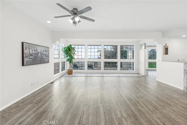a kitchen with appliances cabinets and a dining table