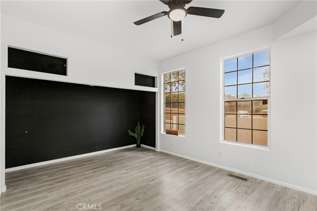 508 Mesa View Drive Arroyo Grande, CA 93420 - Photo 21 of 55 an empty room with wooden floor and windows