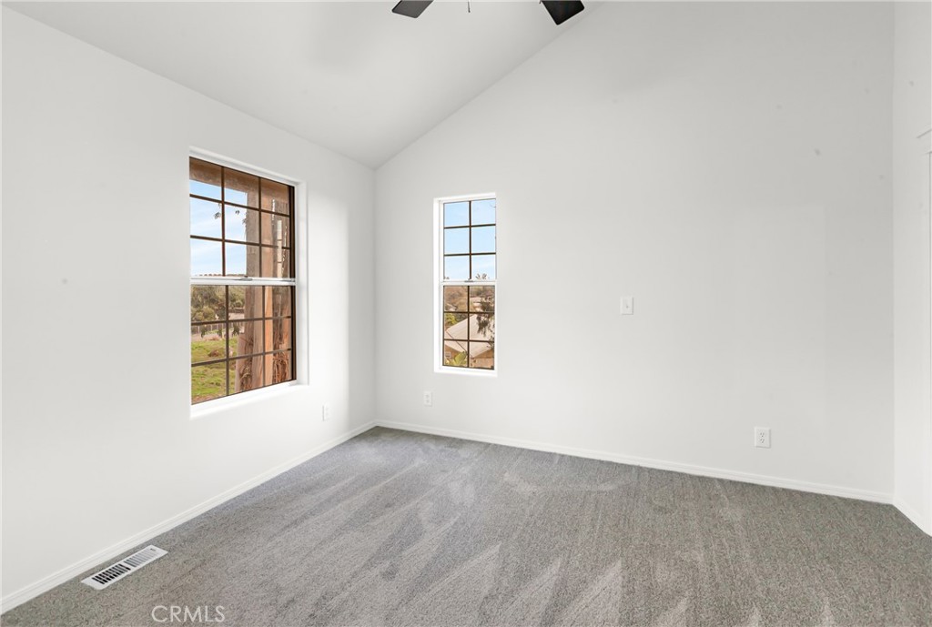 508 Mesa View Drive Arroyo Grande, CA 93420 - Photo 25 of 55 an empty room with wooden floor and windows