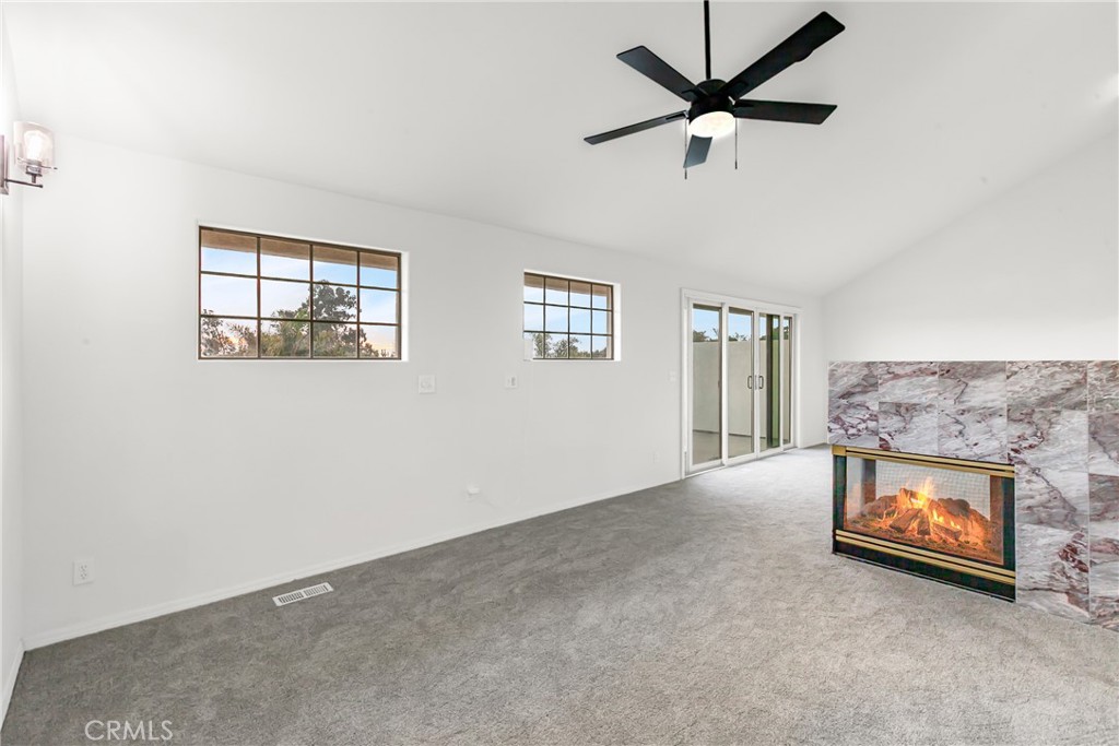 508 Mesa View Drive Arroyo Grande, CA 93420 - Photo 29 of 55 an empty room with windows and ceiling fan