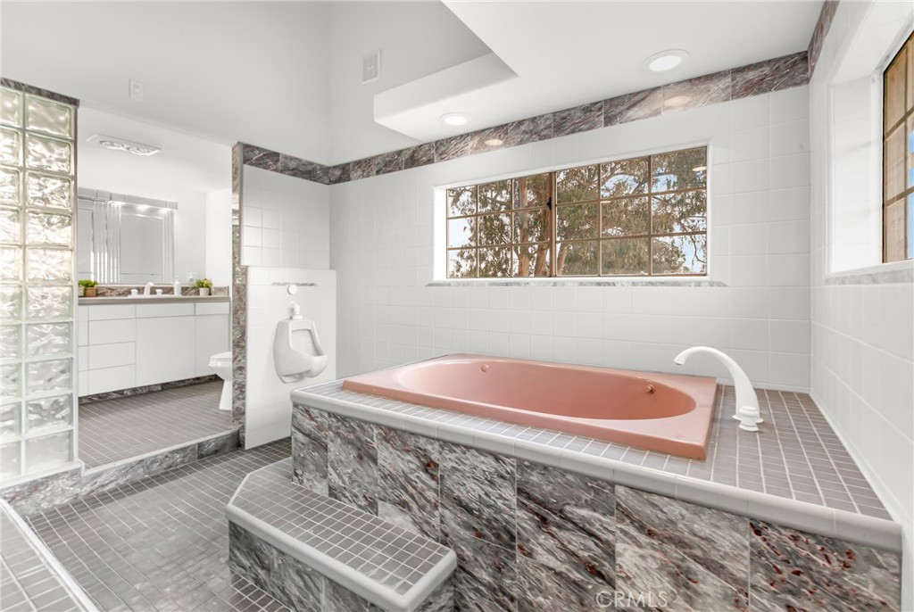 508 Mesa View Drive Arroyo Grande, CA 93420 - Photo 35 of 55 a spacious bathroom with a tub sink and mirror