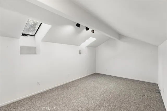 a kitchen with stainless steel appliances granite countertop a stove cabinets and wooden floor