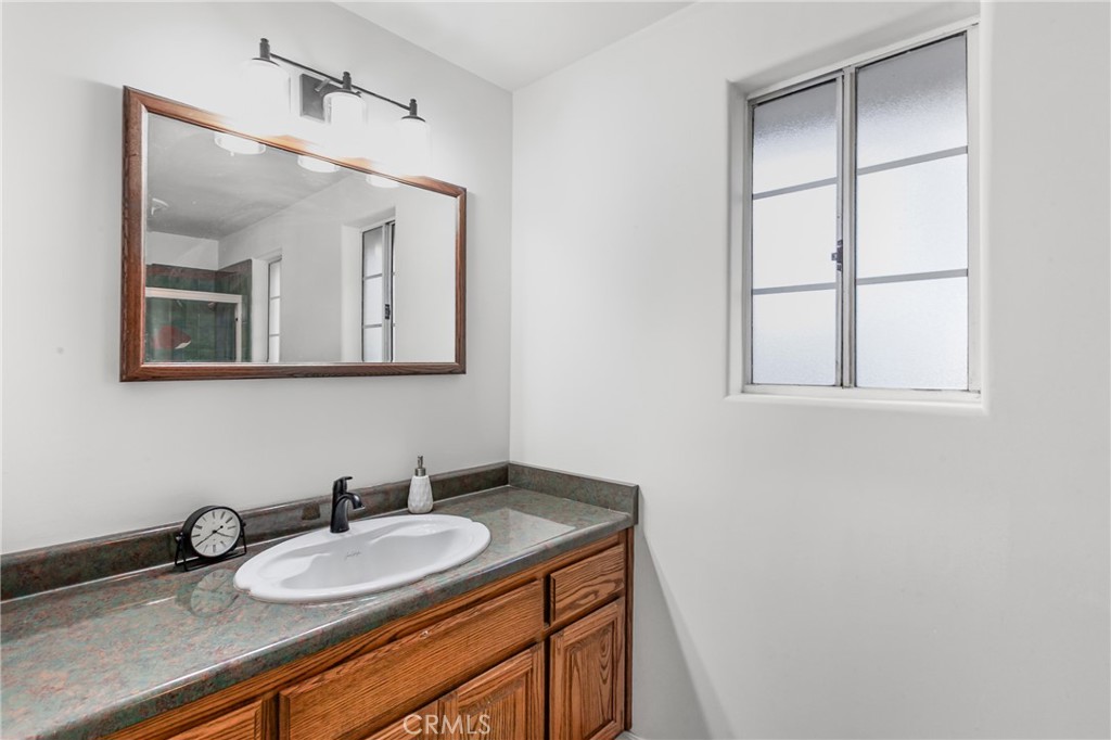 508 Mesa View Drive Arroyo Grande, CA 93420 - Photo 37 of 55 a bathroom with a granite countertop sink and a mirror