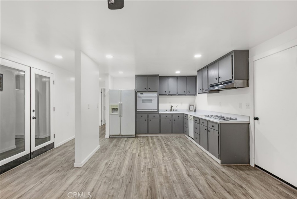 508 Mesa View Drive Arroyo Grande, CA 93420 - Photo 39 of 55 a kitchen with stainless steel appliances granite countertop a stove cabinets and wooden floor