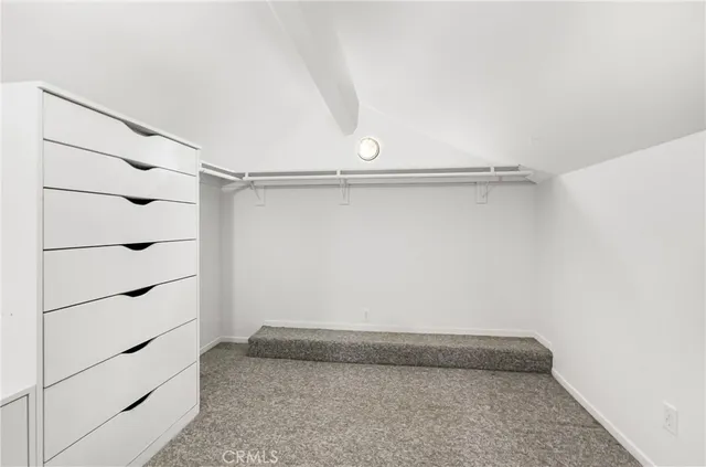 a kitchen with stainless steel appliances granite countertop a stove cabinets and wooden floor