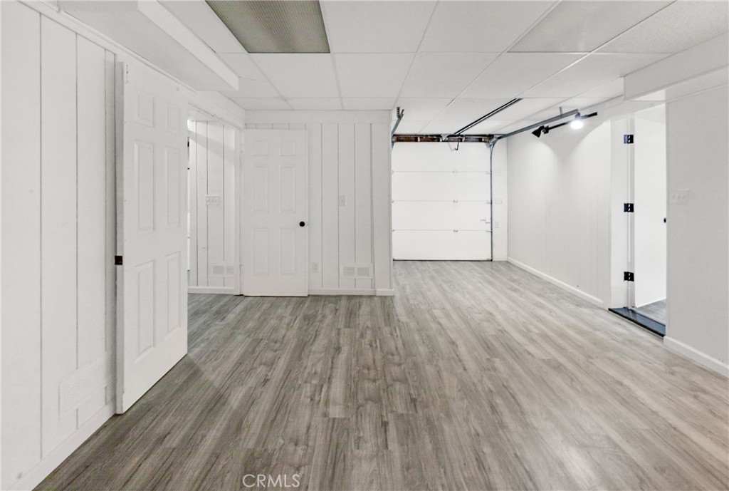 508 Mesa View Drive Arroyo Grande, CA 93420 - Photo 41 of 55 a view of a room with wooden floor and white walls