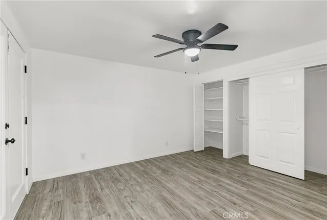 a bathroom with a granite countertop toilet and a shower