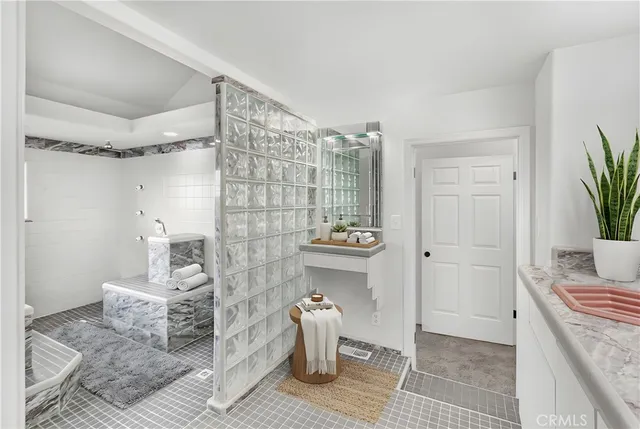 an aerial view of a house with outdoor space and a lake view