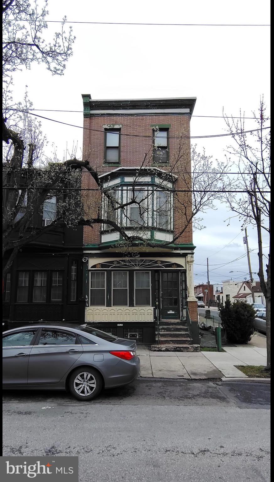 6312 Vine Street Philadelphia, PA 19139 - Photo 2 of 11 a car parked in front of a house