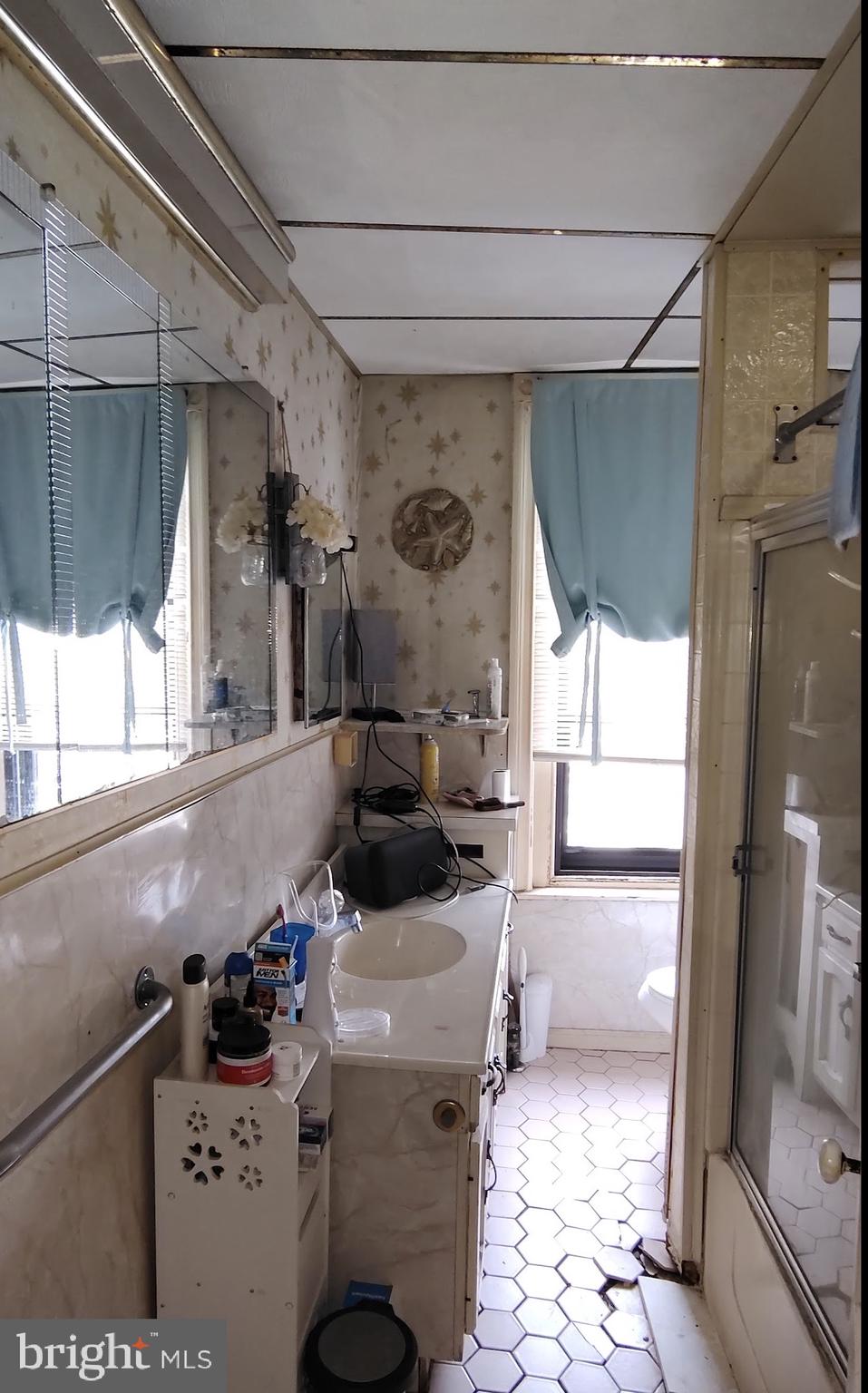6312 Vine Street Philadelphia, PA 19139 - Photo 7 of 11 a bathroom with a sink toilet and shower