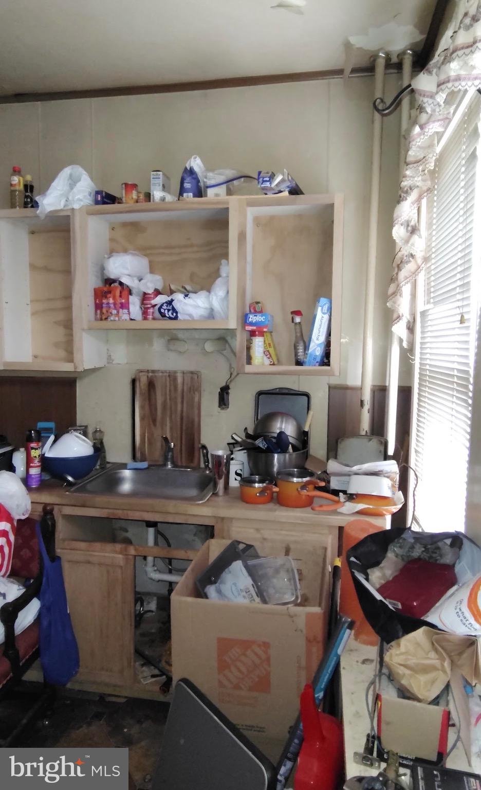 6312 Vine Street Philadelphia, PA 19139 - Photo 8 of 11 a kitchen with a stove and a table