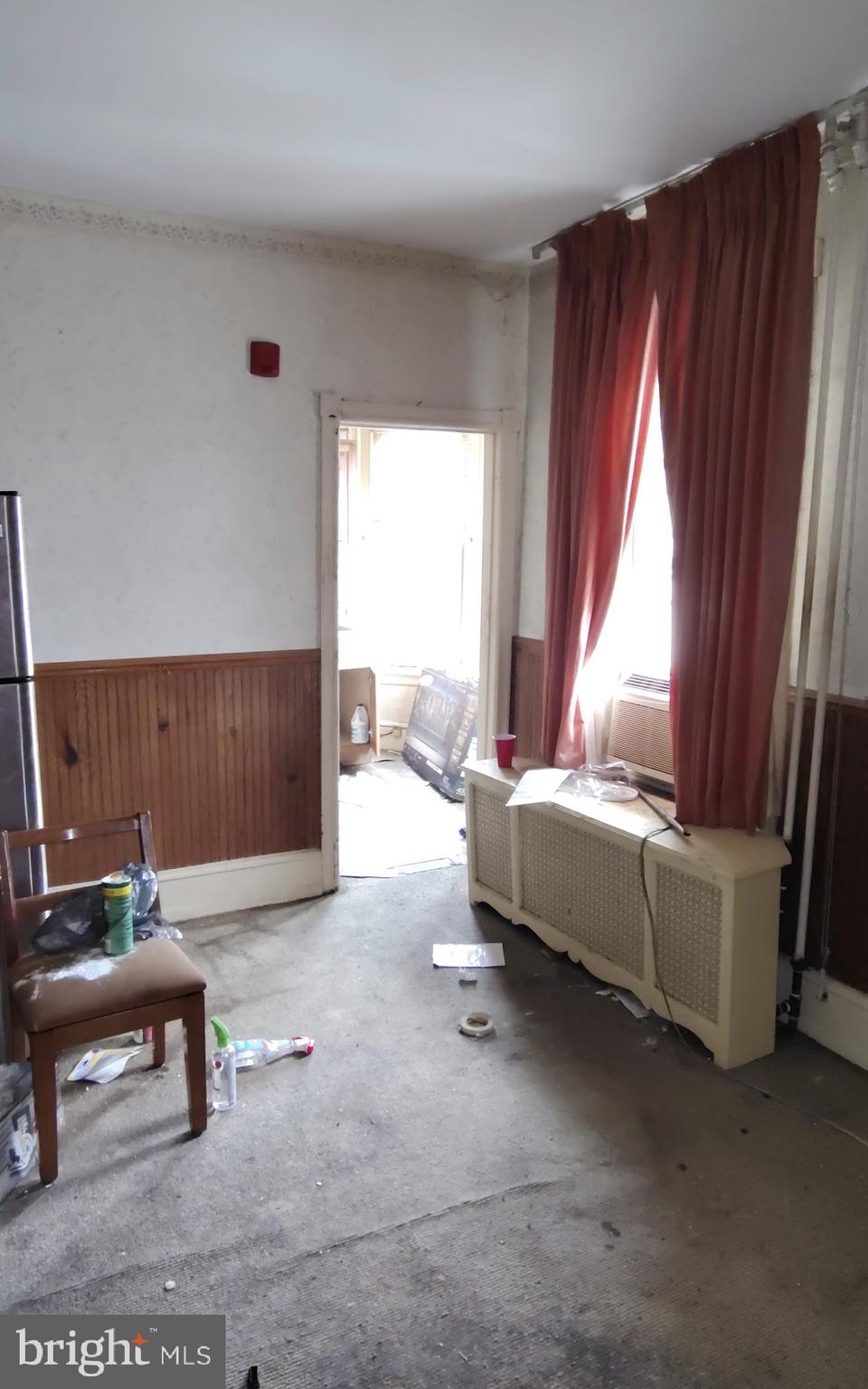 6312 Vine Street Philadelphia, PA 19139 - Photo 10 of 11 a living room with furniture and a window