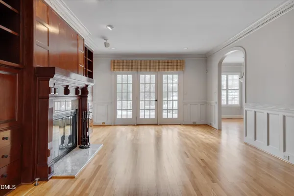 a kitchen with kitchen island granite countertop a sink cabinets and stainless steel appliances