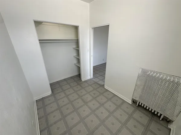 a kitchen with a refrigerator and a stove