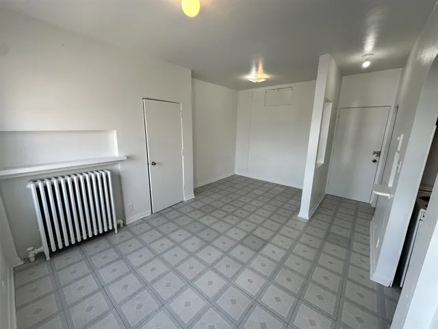 a view of an empty room with a window