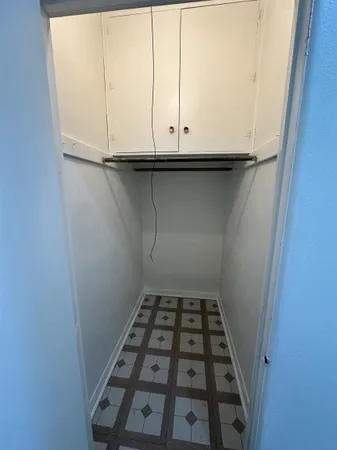 a kitchen with a stove and a refrigerator