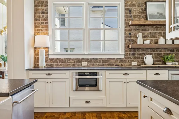 a view of kitchen with wooden floor