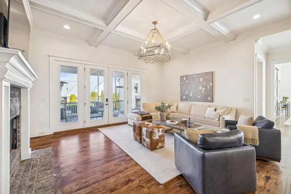 a living room with fireplace furniture and a flat screen tv