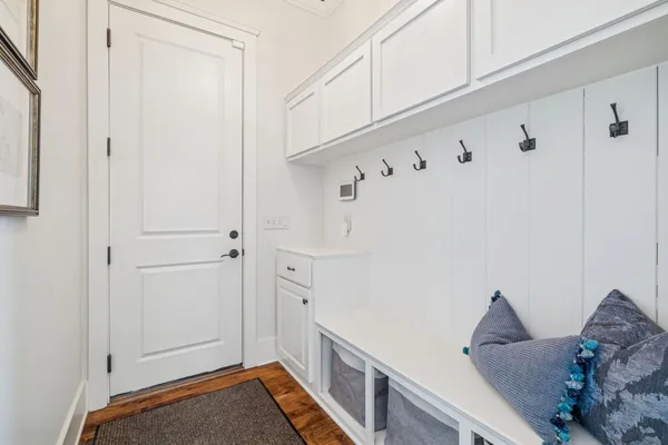 a bathroom with a granite countertop sink a mirror a glass door a shower and vanity