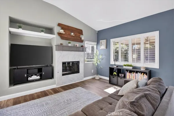 a view of kitchen with microwave and cabinets