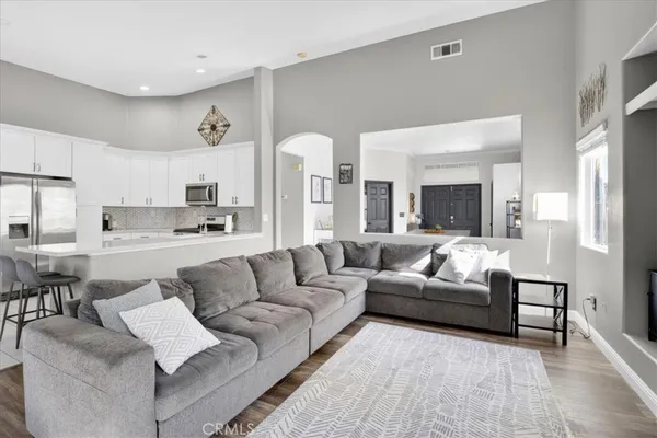 a kitchen with stainless steel appliances a refrigerator sink and stove