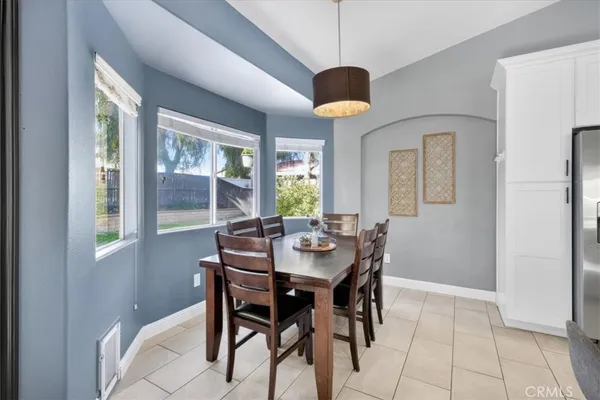 a kitchen with granite countertop white cabinets stainless steel appliances and sink