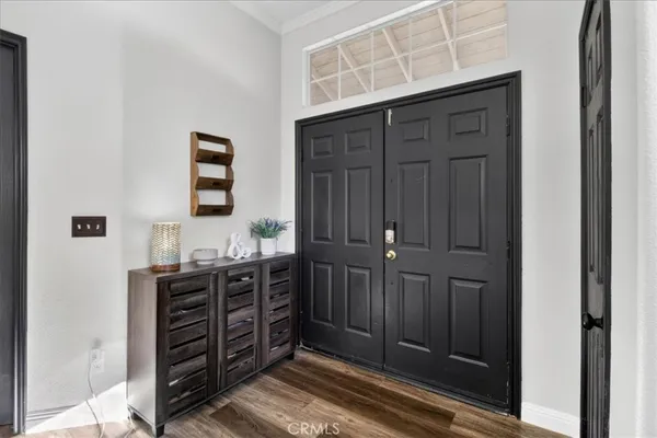 a bedroom with a bed and a mirror