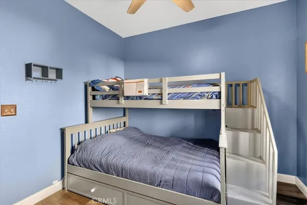 an aerial view of residential houses with outdoor space and parking