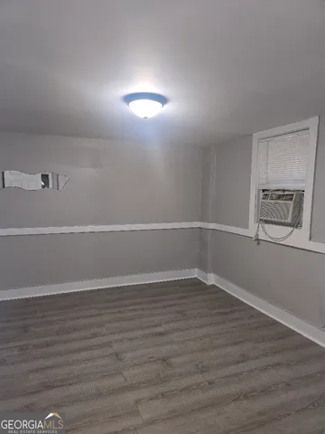 an empty room with wooden floor