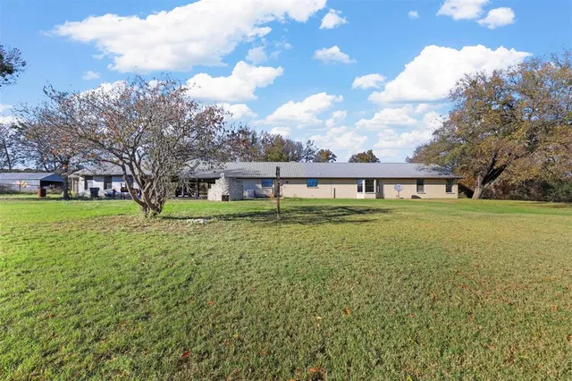 a view of a house with a big yard
