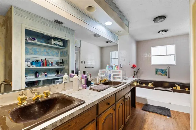 a bedroom with furniture and a ceiling fan