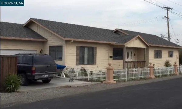 a car parked in front of a house