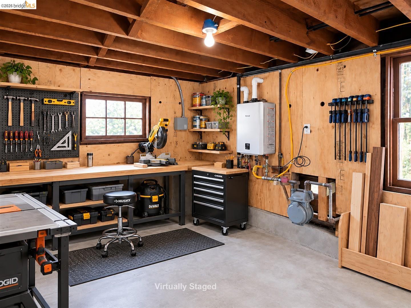 1668 Arch Street Berkeley, CA 94709 - Photo 66 of 78 Exposed wood ceiling beams, wood-paneled walls, concrete flooring, and an installed water heater