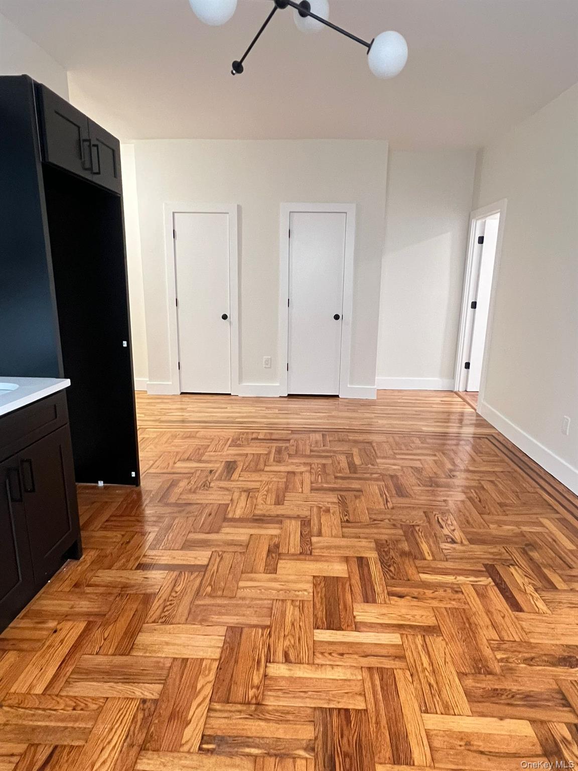486 East 95th Street, Unit 1R Brooklyn, NY 11212 - Photo 7 of 12 a view of a livingroom with wooden floor