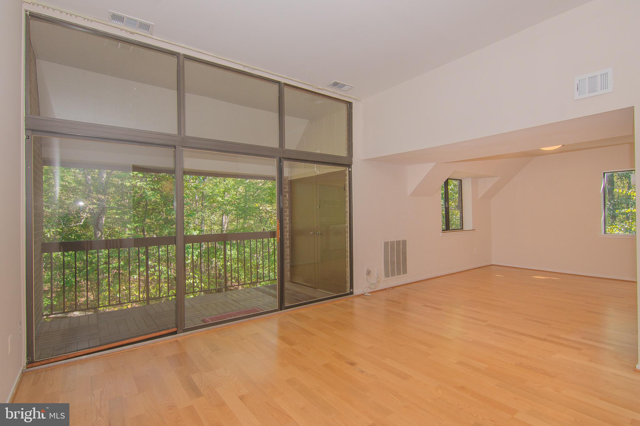 1665 Parkcrest Circle, Unit 301 Reston, VA 20190 - Photo 2 of 30 a view of an empty room with a window