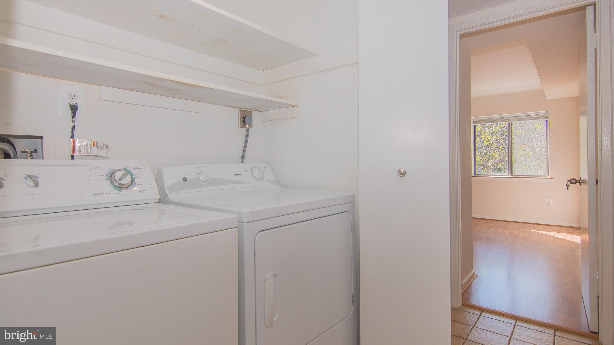 1665 Parkcrest Circle, Unit 301 Reston, VA 20190 - Photo 21 of 30 a utility room with dryer and washer