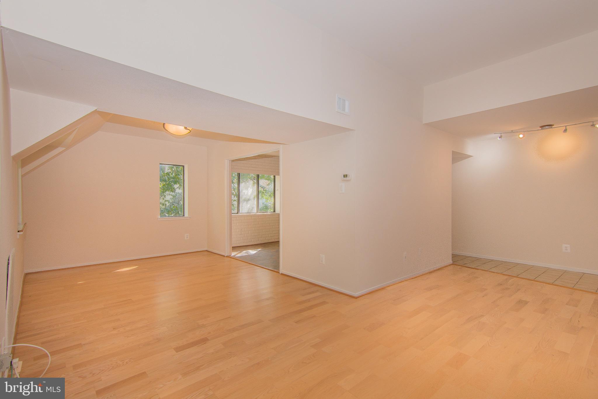 1665 Parkcrest Circle, Unit 301 Reston, VA 20190 - Photo 22 of 30 an empty room with windows and closet