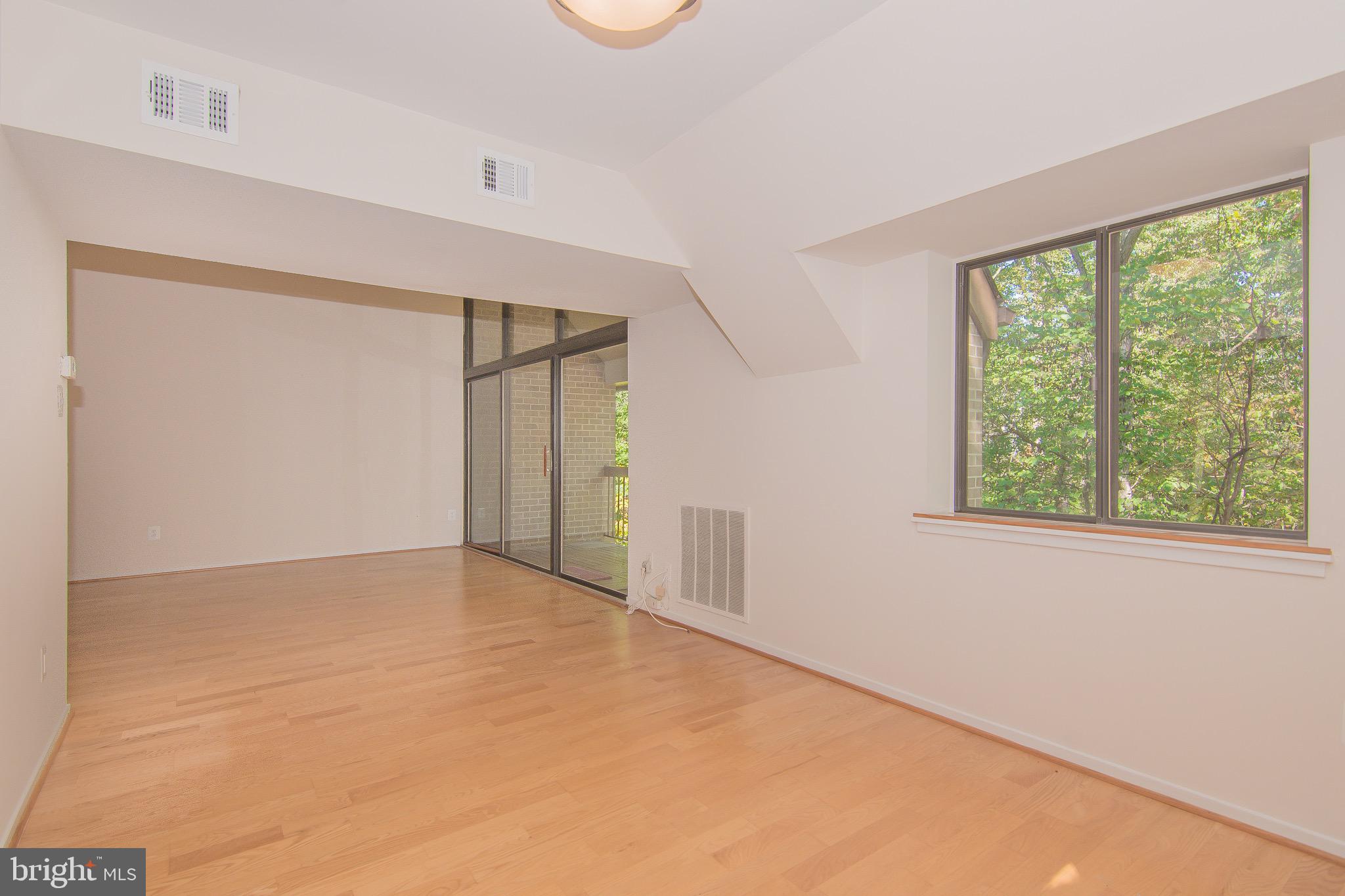 1665 Parkcrest Circle, Unit 301 Reston, VA 20190 - Photo 7 of 30 a view of an empty room with a window