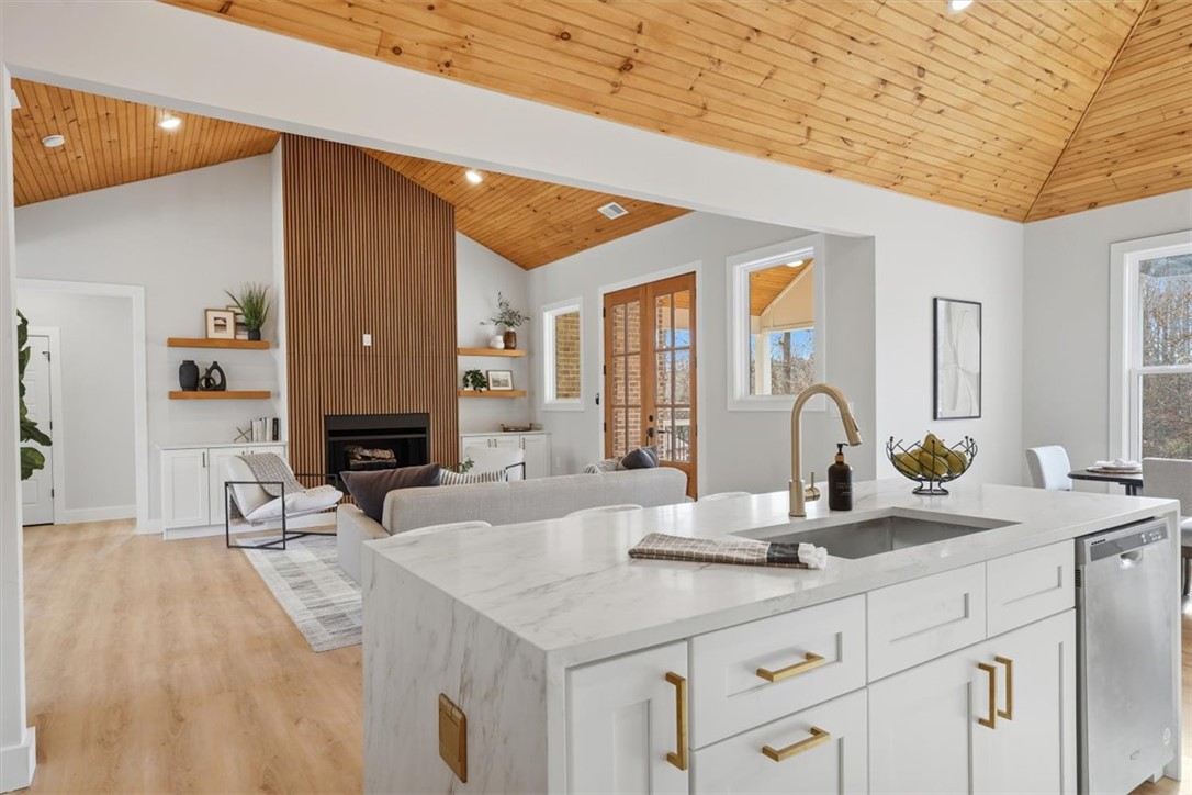 304 Avenue Of Oaks Anderson, SC 29621 - Photo 14 of 38 This open concept living space features a modern kitchen and inviting living room.