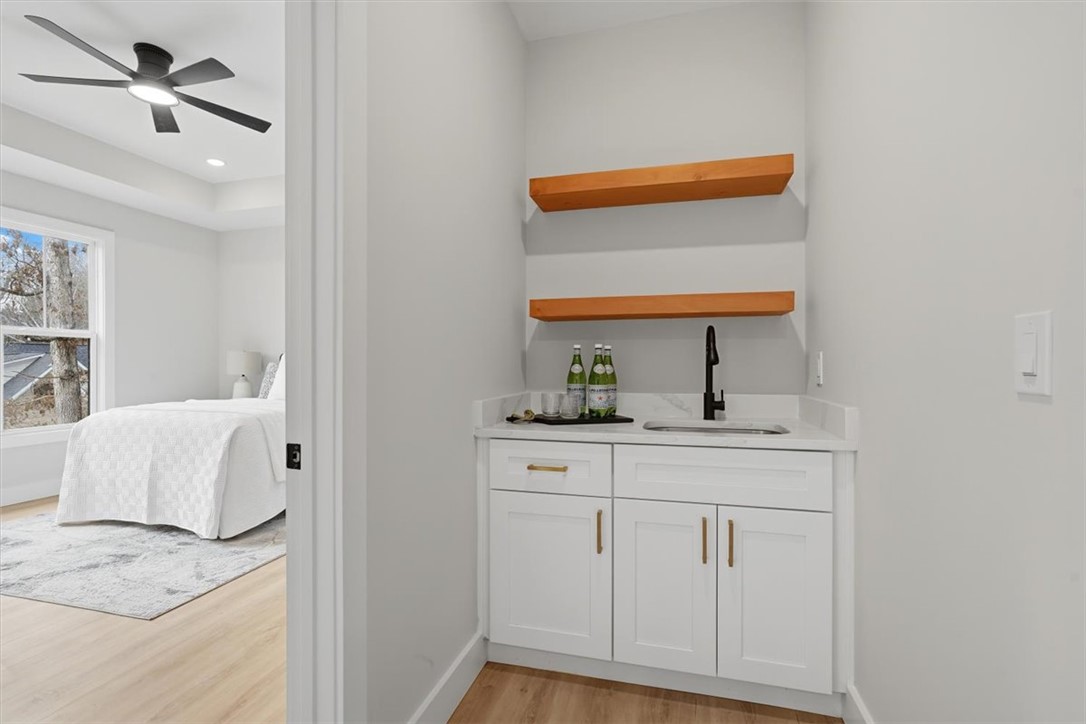304 Avenue Of Oaks Anderson, SC 29621 - Photo 18 of 38 This bright space features a convenient wet bar area adjacent to a cozy bedroom.