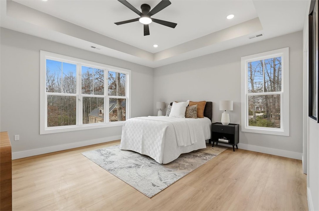 304 Avenue Of Oaks Anderson, SC 29621 - Photo 19 of 38 This spacious bedroom offers ample natural light and a serene view of the outdoors.