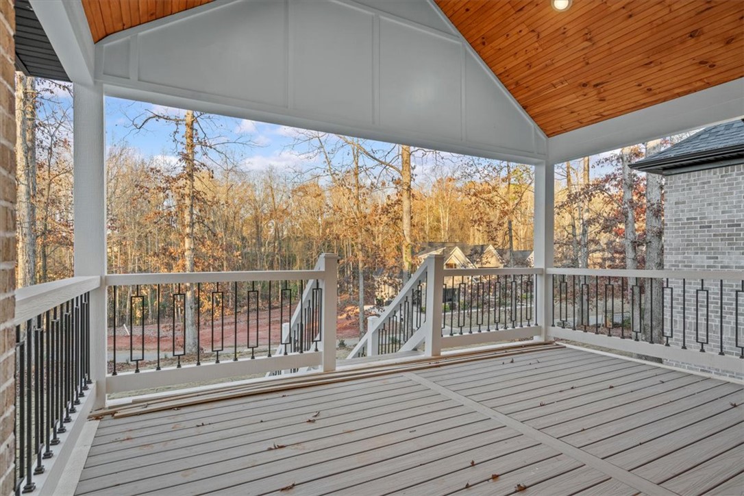 304 Avenue Of Oaks Anderson, SC 29621 - Photo 29 of 38 This outdoor deck features a wooden ceiling and offers serene views of the surrounding natural landscape.